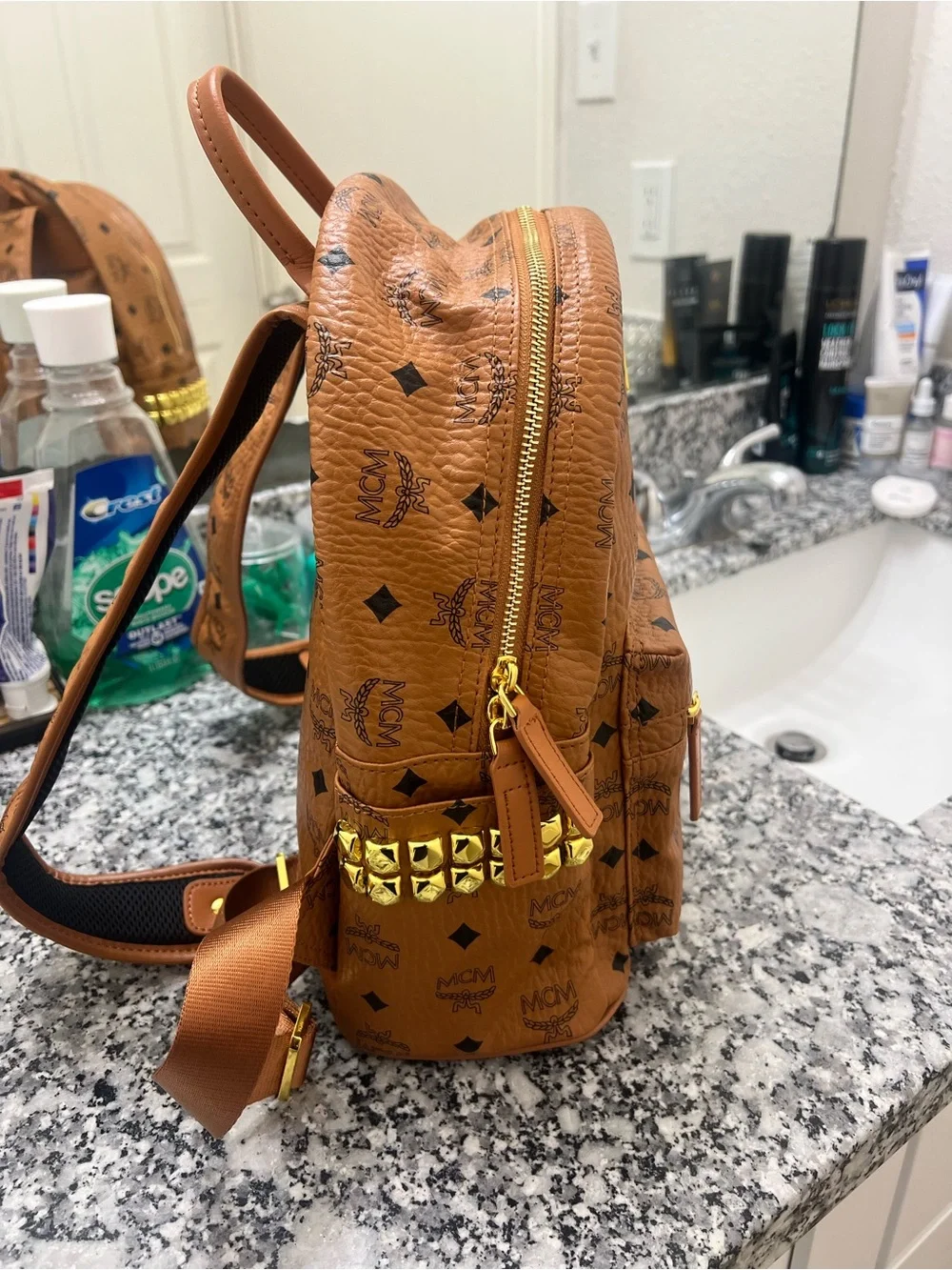 MCM Cognac Monogrammed Leather Mini Backpack with Gold Plaque